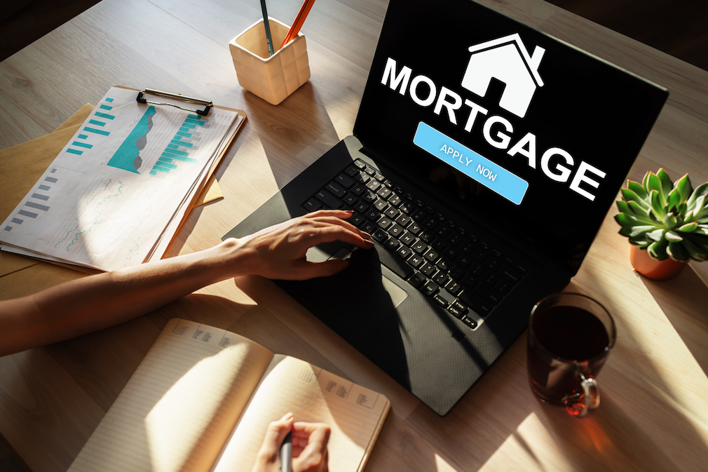 Mortgage online application form on device screen. Business and finance concept.