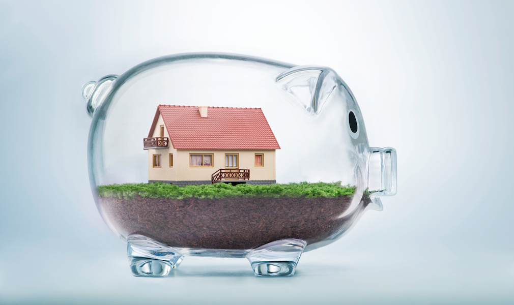 Saving to buy a house or home savings concept