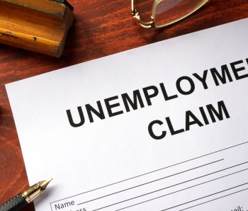 Unemployment claim form on an office table.