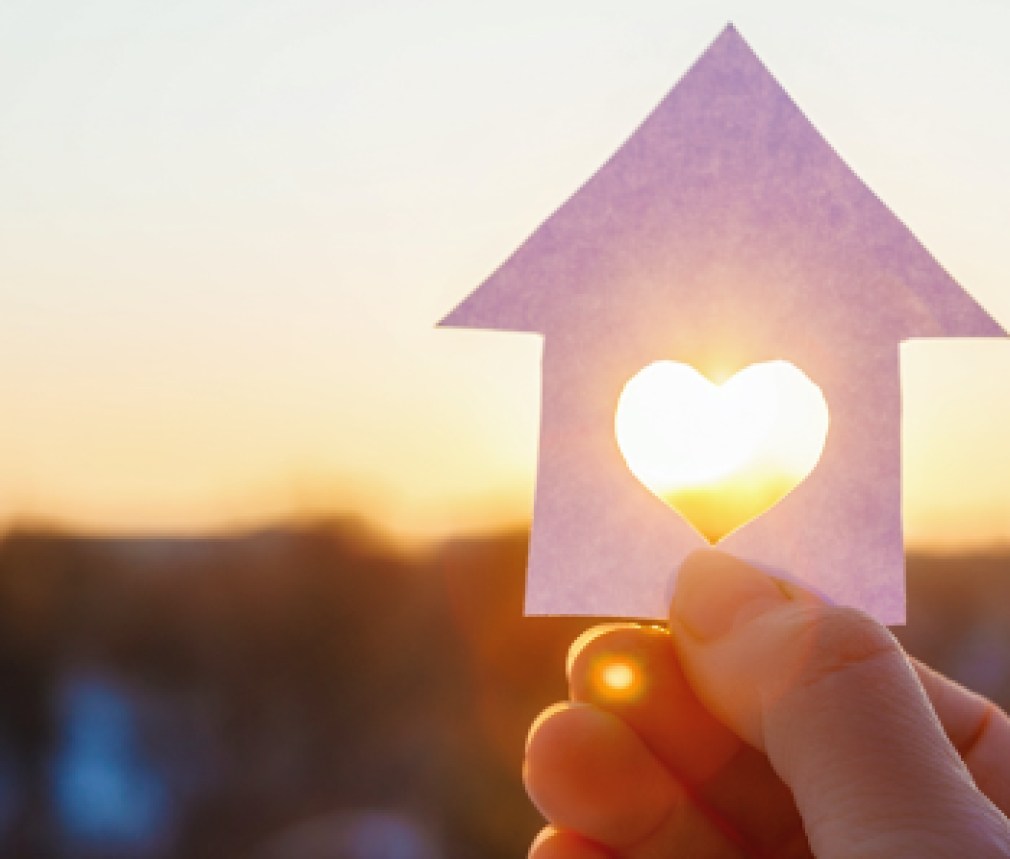 House with a carved heart on of sunrise.