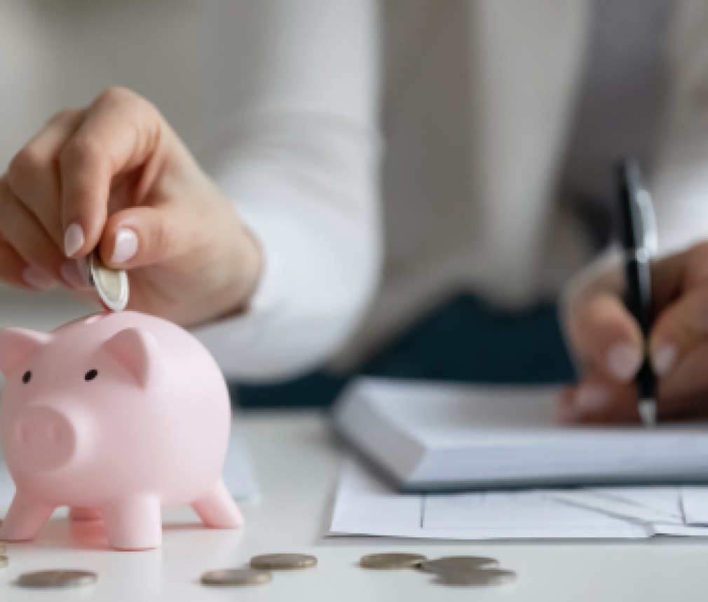 Close up of woman saving money managing home finances