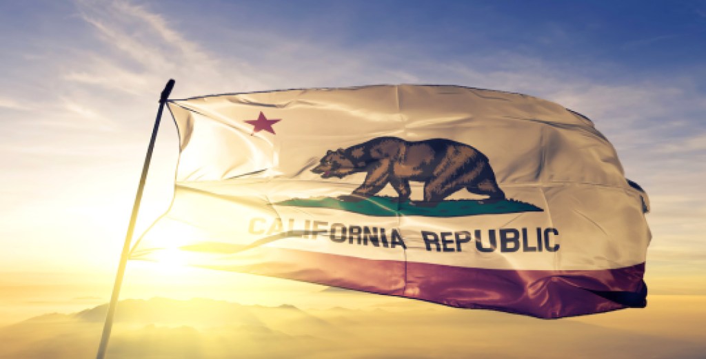California state of United States flag waving on the top sunrise mist fog