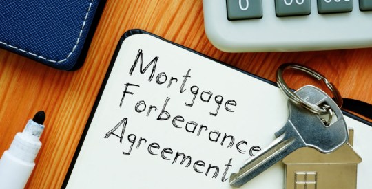 Mortgage Forbearance Agreement is shown on the conceptual business photo