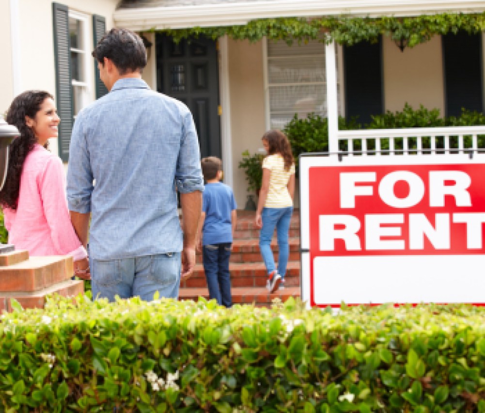 Hispanic family outside home for rent