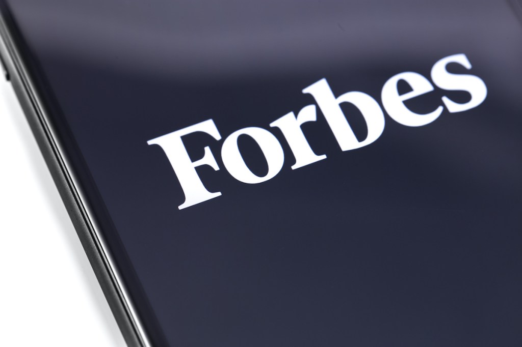Forbes logo on the screen smartphone. Forbes is an American family-controlled business magazine. Moscow, Russia - February 28, 2019