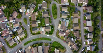 Top down aerial view of urban houses and streets in a residential area of a Welsh town