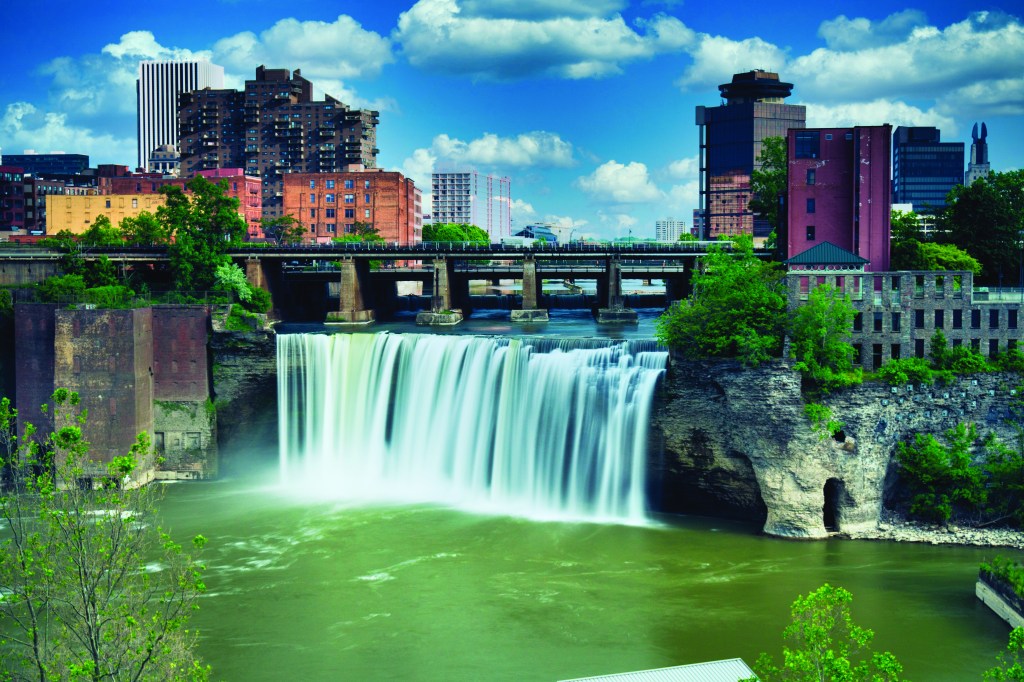 High Falls district in Rochester New York under cloudy summer sk