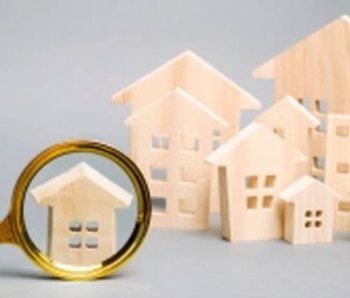 Wooden-houses-with-magnifying-glass