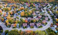 birds-eye view of multi-family home neighborhood in autumn