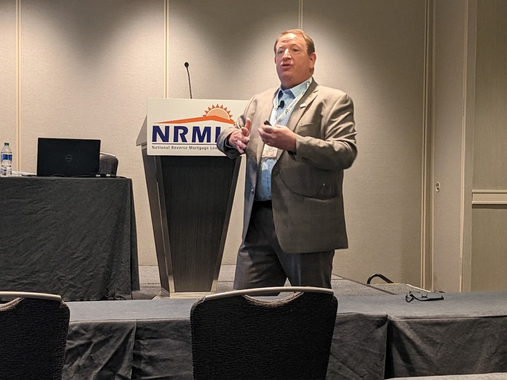 Reverse mortgage educator Craig Barnes speaking at the NRMLA Annual Meeting and Expo in Atlanta, Ga. in November 2022.