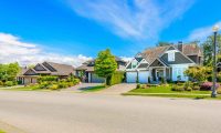 street level view of medium income single-family home neighborhood