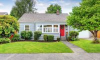 small modest home with tidy front yard