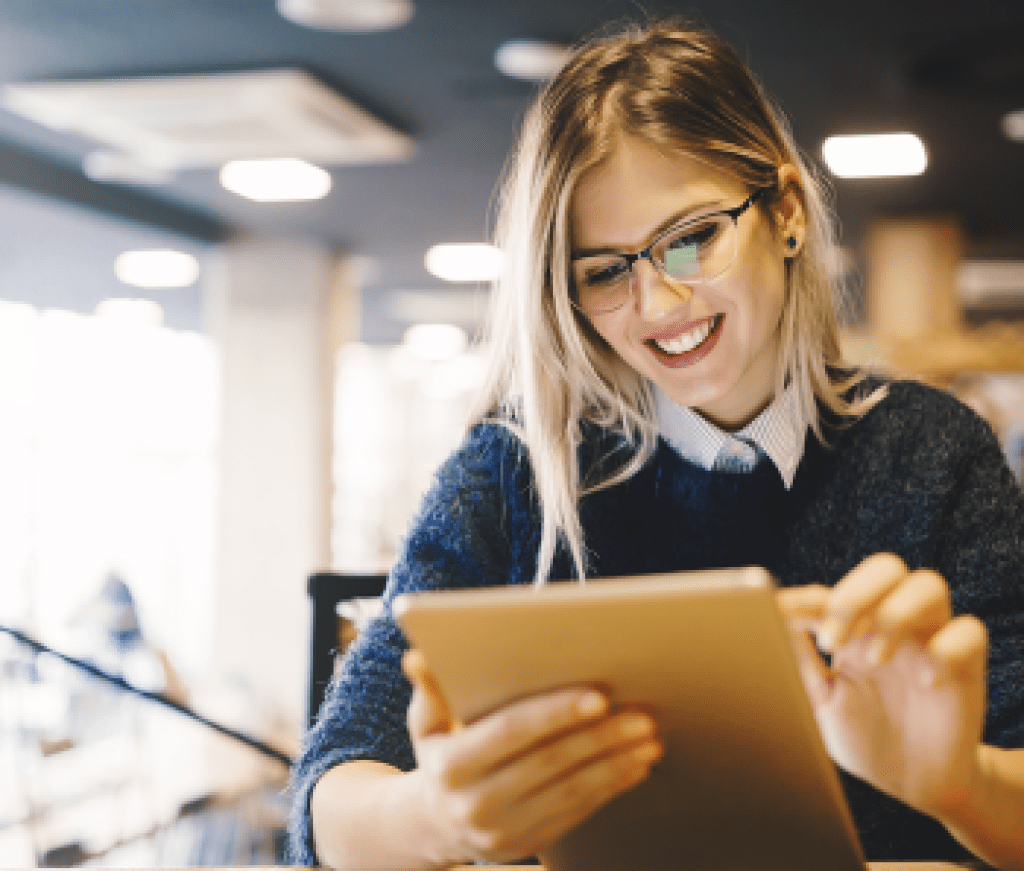 Smiling woman using a tablet computer