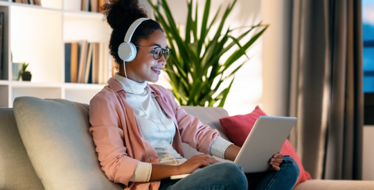 Woman listening to real estate podcast