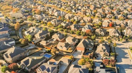 birds-eye view of middle income single-family home Texas neighborhood in the fall