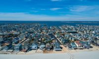 birds-eye view of high income single-family home beach coastal neighborhood