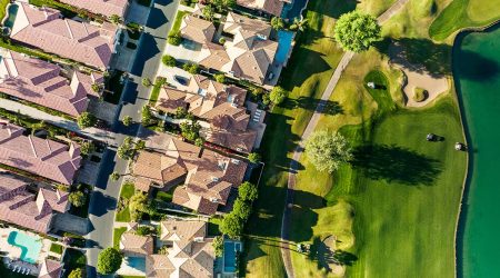 Resort or golf course real estate niche; pictured: Homes on a golf course (aerial view)