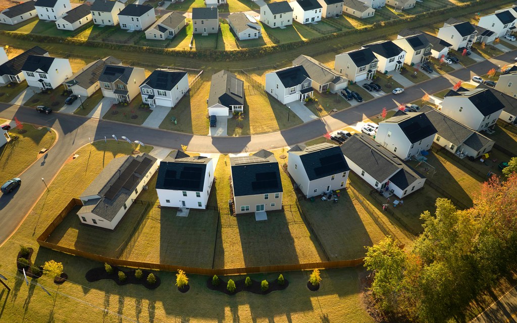 Aerial view of tightly packed homes in South Carolina residential area. New family houses as example of real estate development in american suburbs